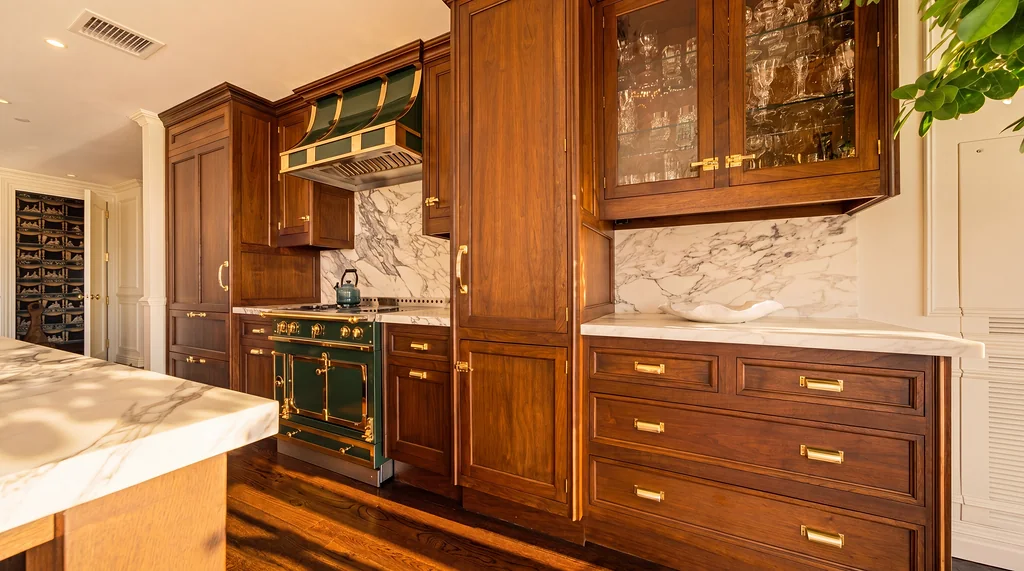 The Visionaire — wood kitchen cabinetry and marble backsplash